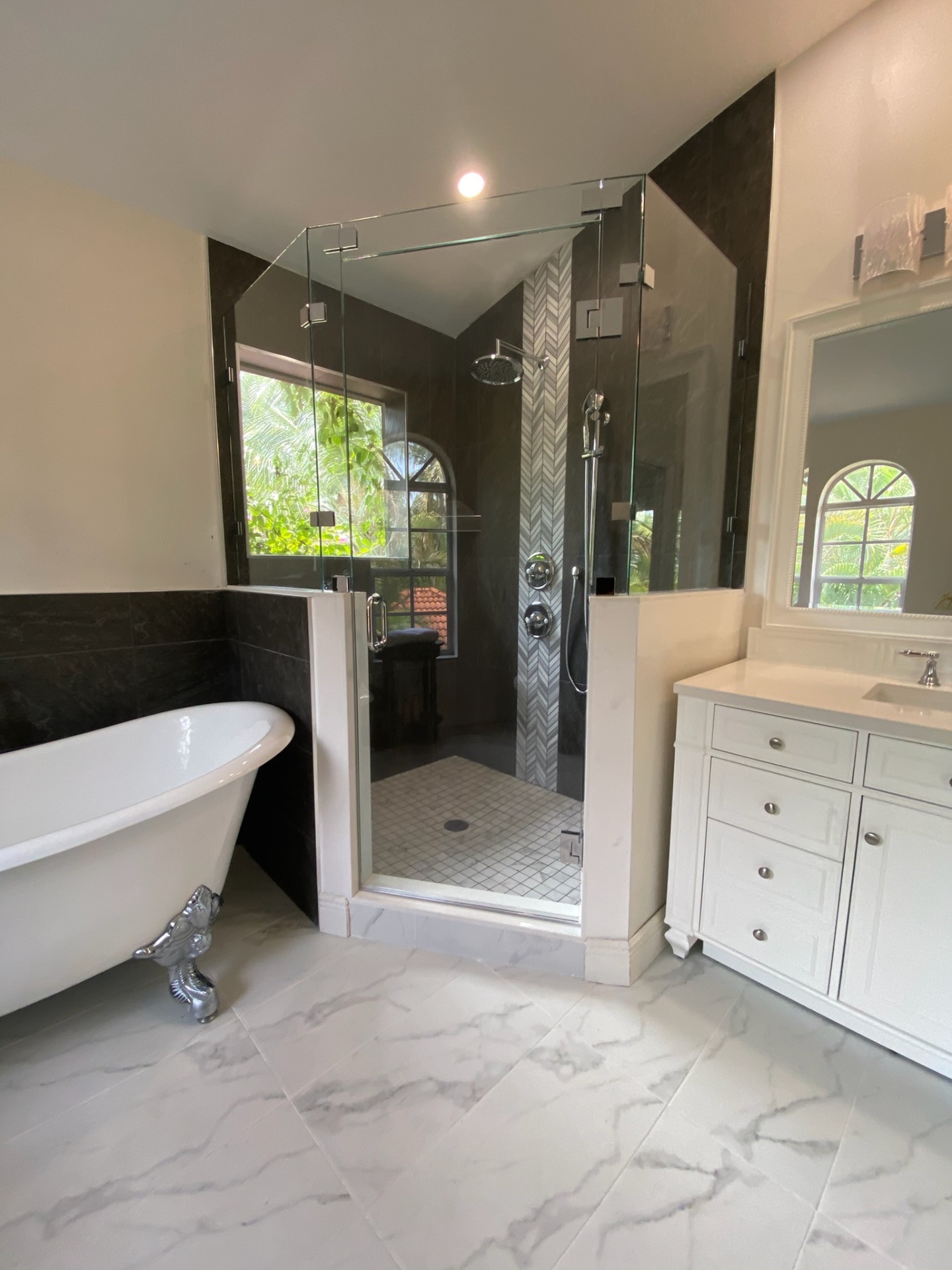 Frameless shower enclosure