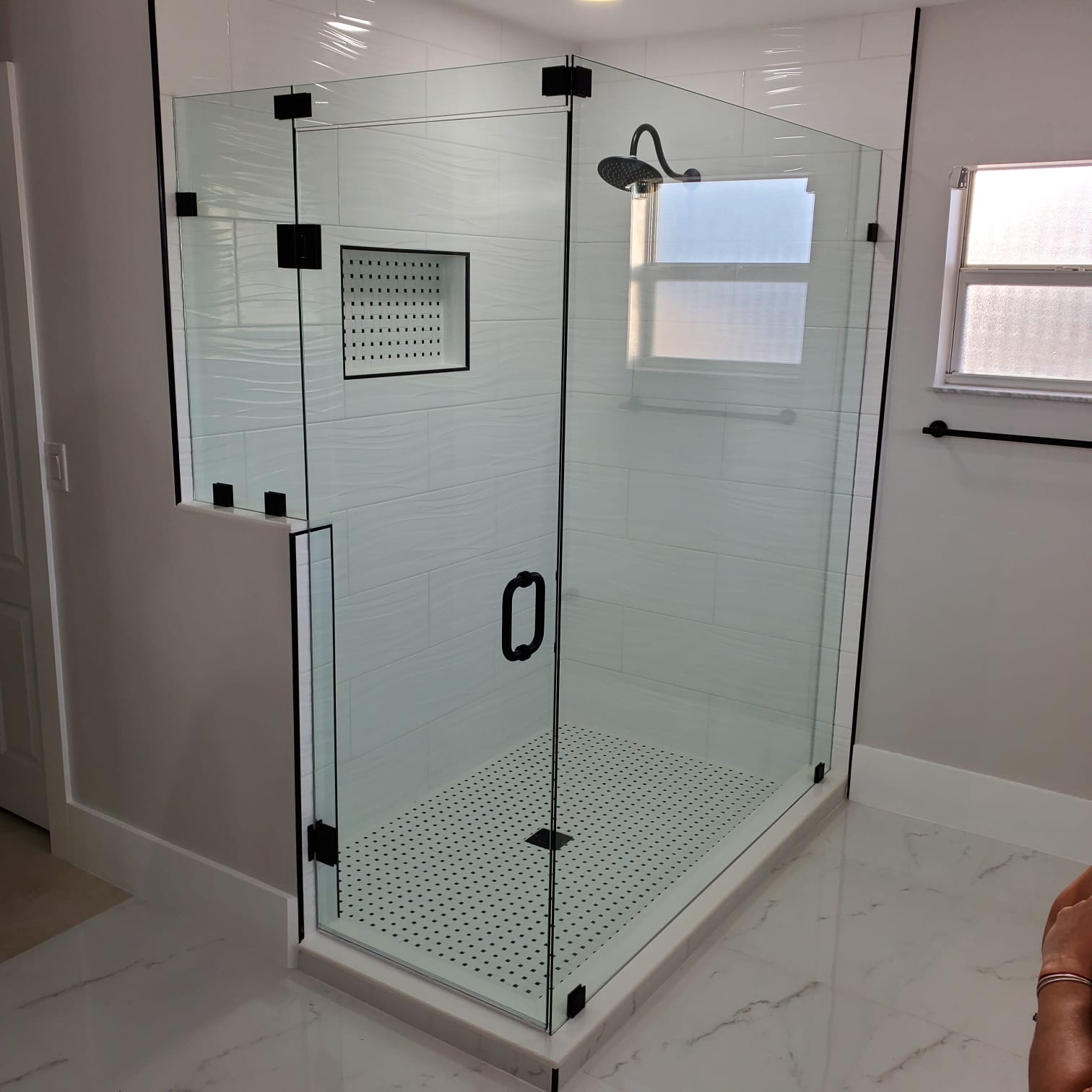 Frameless shower enclosure